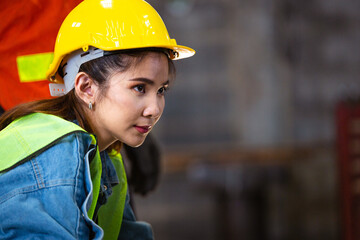 Female factory worker or engineer looking forward with blank space. labor and employment. copy space