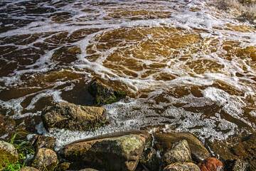 Water flows on the river near the hydroelectric dam