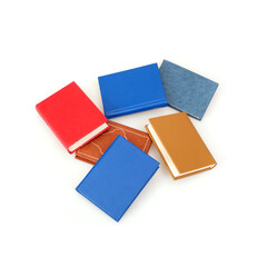 Stack of books in colour covers with white sheets isolated on a white background