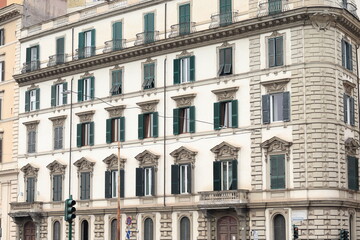 Rome Traditional Building Facade with Green Shutters and Iron Balconies, Italy