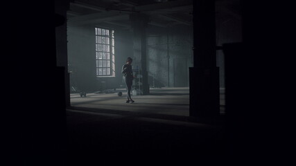 Girl with skipping rope walking in sport club. Woman resting after exercises 