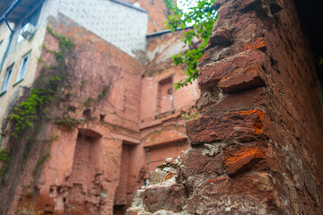 walls of an old ruined red brick building