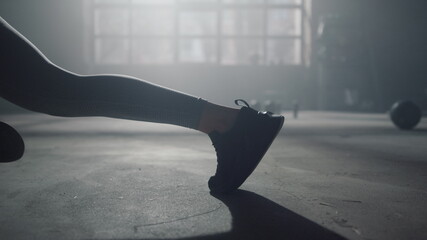 Woman legs doing mountain climber exercise. Sportswoman having workout in plank