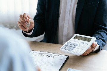 Real estate agent broker and customer with loan or insurance contract documents..