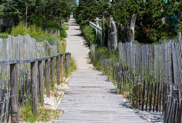 Walkway over sand dunes into the neighborhoods on Fire Island