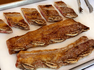 Assado de Tira or Strip roast. Traditional beef rib cut for a delicious barbecue on white background.
