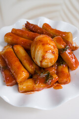 homemade Korean tteokbokki stir fried rice cake in spicy red sauce.