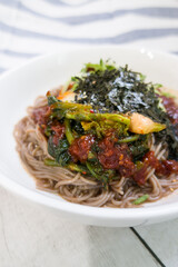korean spicy buckwheat noodles with various vegetables.