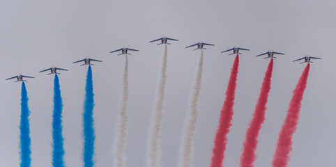Paris, France - 07 14 2021: Air show of July 14. Alphajet of the patrol of France flying .