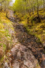A view up a small waterfall in the Glen Nevis valley, Scotland on a summers day