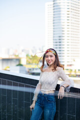 Portrait of sexy Asian woman in sexy top and jeans.