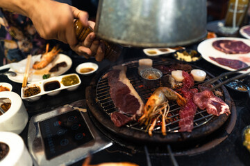 Beef and shrimp on the grill at the restaurant