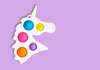 Multi-colored popular silicone anti-stress toy pop it. Colorful anti stress sensory toy fidget push pop it. - obrazy, fototapety, plakaty