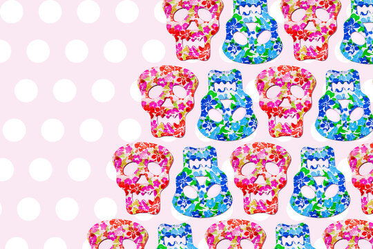 Pattern of rows of red and blue skull masks decorated with floral print
