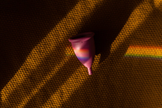 Menstrual cup in prism rainbow