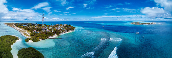 Thulusdhoo Island amidst blue sea at Kaafu atoll, Maldives
