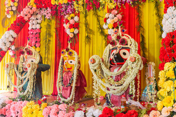 Fototapeta premium Idol of God Jagannath, Balaram and Suvodra is being worshipped. Ratha jatra festival at Howrah, West Bengal, India.