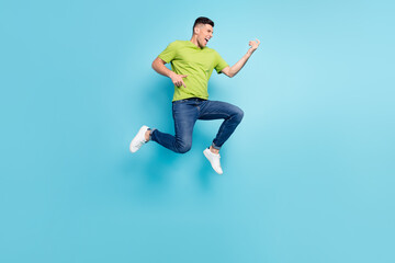 Fototapeta na wymiar Full length body size photo man jumping up imagine playing guitar isolated pastel blue color background