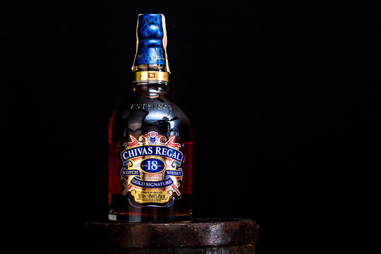 Chivas Regal 18 is blended from whiskies matured for at least 18 years. Whisky bottle on barrel. Illustrative editorial photo Bucharest, Romania, 2021