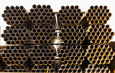 Steel Pipes bunch in the steel factory - Powered by Adobe