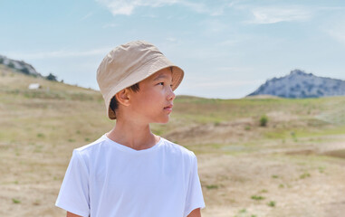 Portrait of an Asian boy in a white T-shirt
