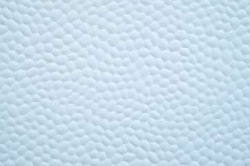 Fototapeta premium White decorative plastic surface covered with small hexagons close