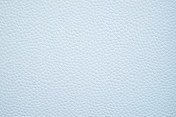 White decorative plastic surface covered with small hexagons close