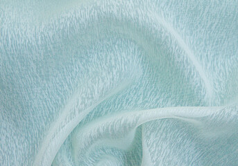 Fototapeta na wymiar White and blue crumpled fabric background,light airy, transparent fabric texture.