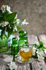 Tea with jasmine flowers. medicinal herbs. Selective focus. medicine and health nature.