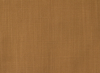 Golden red fabric background with a small round rib. Cotton fabric with a simple pattern