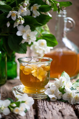 Tea with jasmine flowers. medicinal herbs. Selective focus. medicine and health nature.