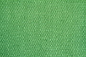 Natural green color fabric background with a small round rib. Cotton fabric with a simple pattern