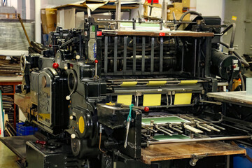 Fototapeta premium selective focus, die cutting machine for pattern cutting in printing house