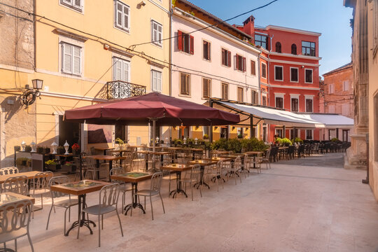Cafe amidst buildings at Dante Square, Istria
