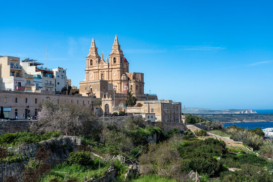 Malta, Northern Region, Mellieha, Edge of town with Parish Church of Nativity of Virgin Mary in background
