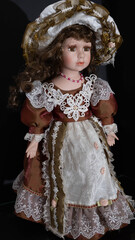 Porcelain collectible doll in a fluffy dress