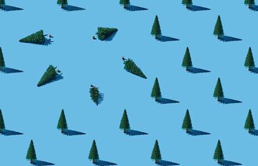 Pattern of fir trees on blue pastel background