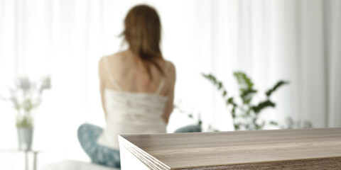 Obraz na płótnie Canvas Desk of free space and woman with window background 