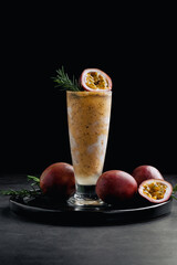 Passion fruit smoothhie on black background - 445431367