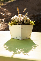 centerpiece with wild flowers and wooden planter
