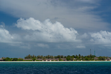 Fototapeta na wymiar magnificent view of the coral island with a white sandy beach and dense vegetation