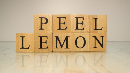 The word peel lemon was created from wooden letter cubes. Gastronomy and spices.