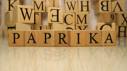 The word Paprika was created from wooden letter cubes. Gastronomy and spices.