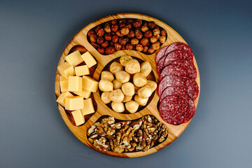 Menazhnitsa with hazelnuts, walnuts, salami and cheese