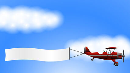red biplane with a ribbon. sky and clouds © Михаил Соколов