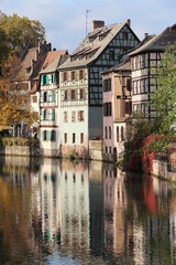 Fototapeta na wymiar old half-timbered houses near the channel in alsatian Strasbourg, France