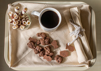 Tray With Coffee Served For Breakfast.
Tray With Jug Of Hot Fresh Coffee And Cookies Placed On The Table In The Morning.Cenital plane