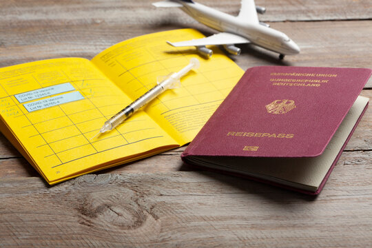 Travel pass with coronavirus immunization certificate on table