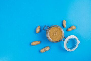 Homemade peanut butter in a jar and bowl.