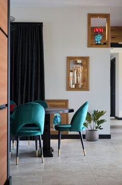 Dining room with green chairs at home
